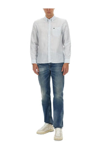 Lacoste men’s light blue and white striped long-sleeved button-down shirt with embroidered chest pocket logo