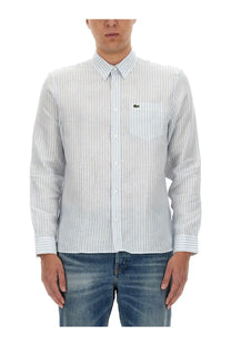 Lacoste men’s light blue and white striped long-sleeve button-down shirt with green crocodile logo on chest pocket