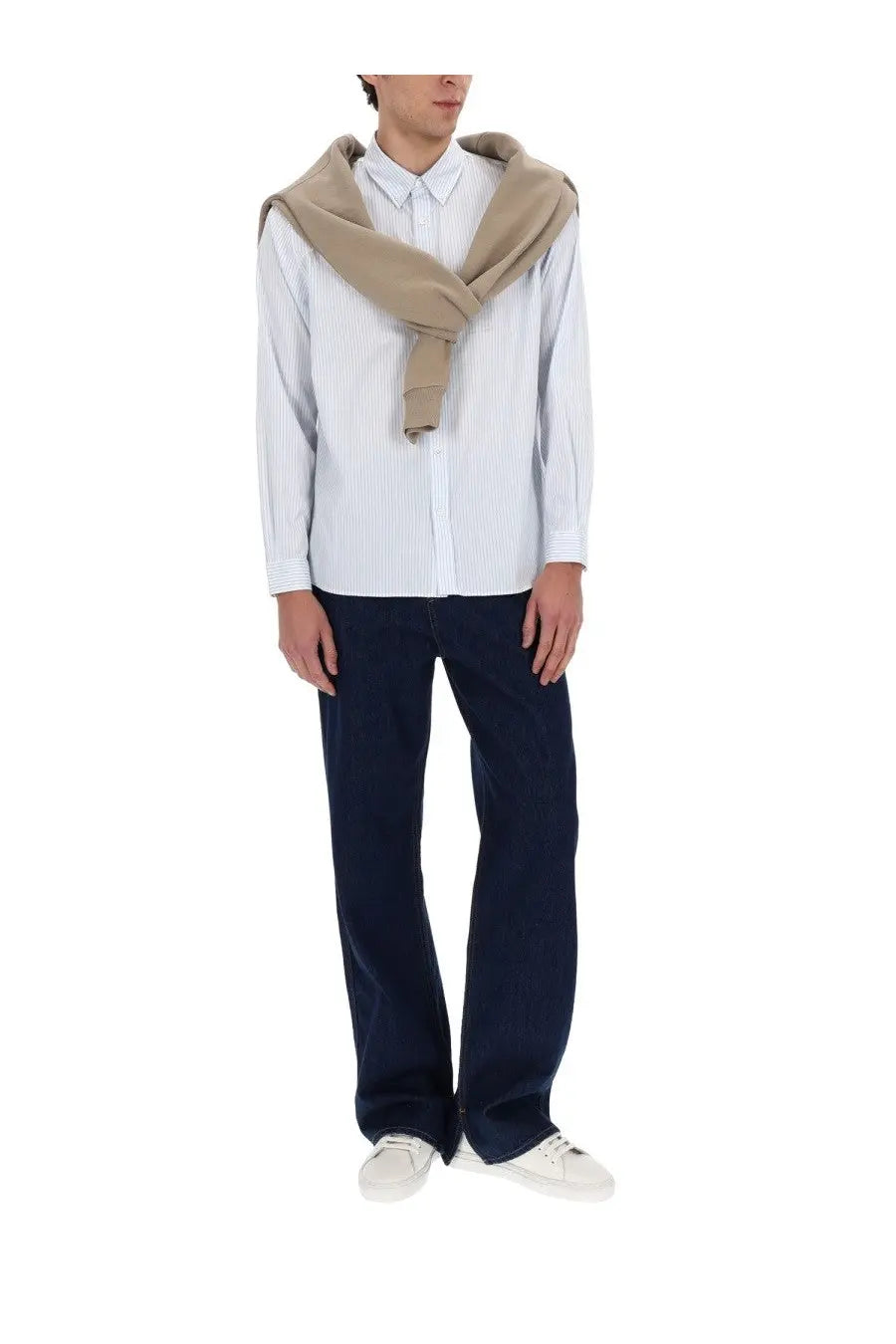 Beige woolen scarf draped over shoulders with lacoste men’s white shirt visible in the image