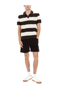 Lacoste men shorts in cotone con brown paired with black and cream striped ribbed polo shirt front view