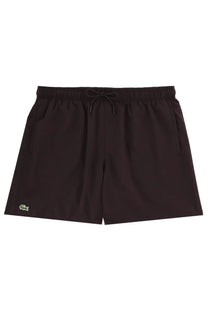 Lacoste men’s black swim trunks with green crocodile logo on lower left leg for swimming and beach use
