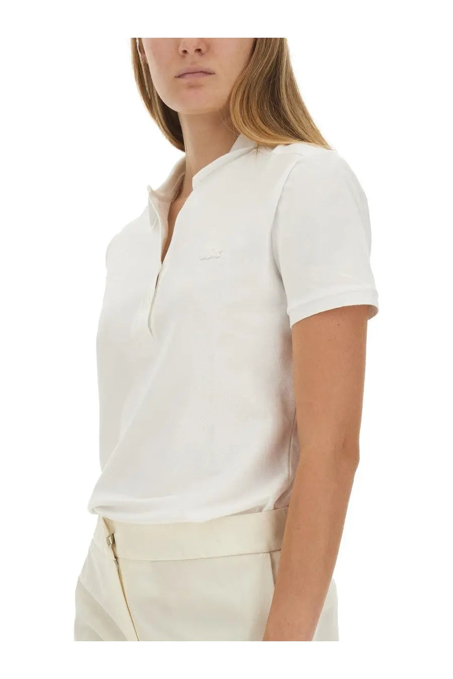 Lacoste women’s white short-sleeved polo shirt with subtle textured fabric and small embroidered logo on chest