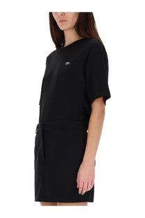 Lacoste women’s black short-sleeved dress with subtle embroidered logo on chest and side pockets made from soft fabric