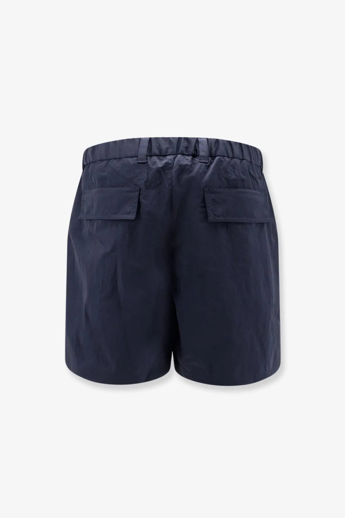 Back side of laminar men’s nylon bermuda shorts in navy blue with elastic waistband and two back pockets