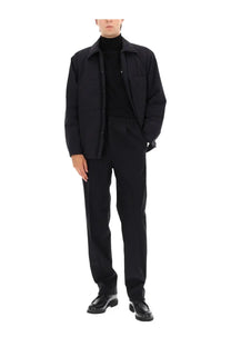 Black laminar mens two layer goretex shirt jacket featuring a cotton blend overshirt with structured collar and buttons
