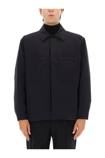 Laminar men’s two layer Goretex shirt jacket black with long sleeves collar and two front pockets visible from front
