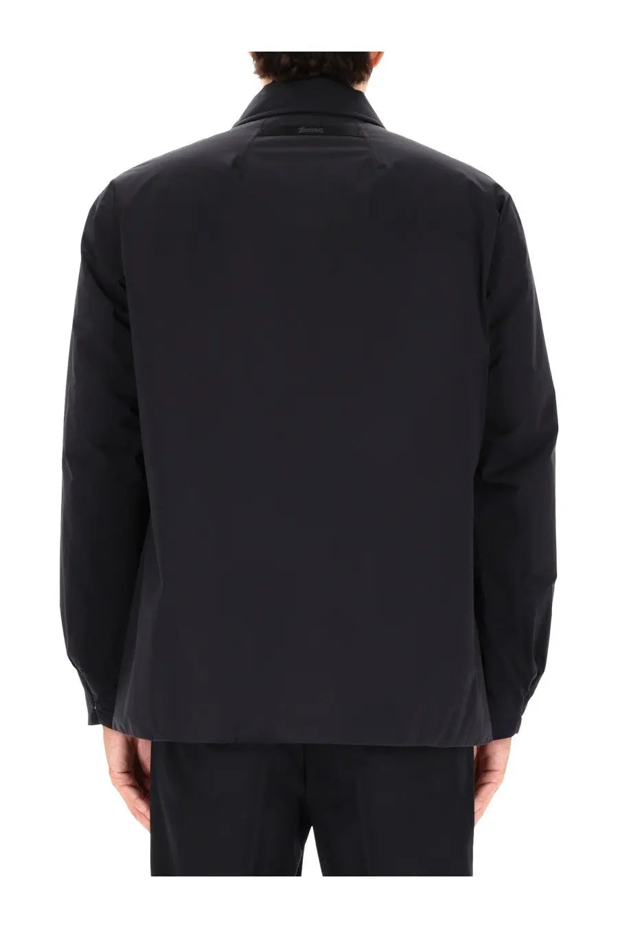 Black sleek minimalist laminar men’s two layer goretex shirt jacket with structured collar and clean lines