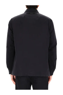 Black sleek minimalist laminar men’s two layer goretex shirt jacket with structured collar and clean lines
