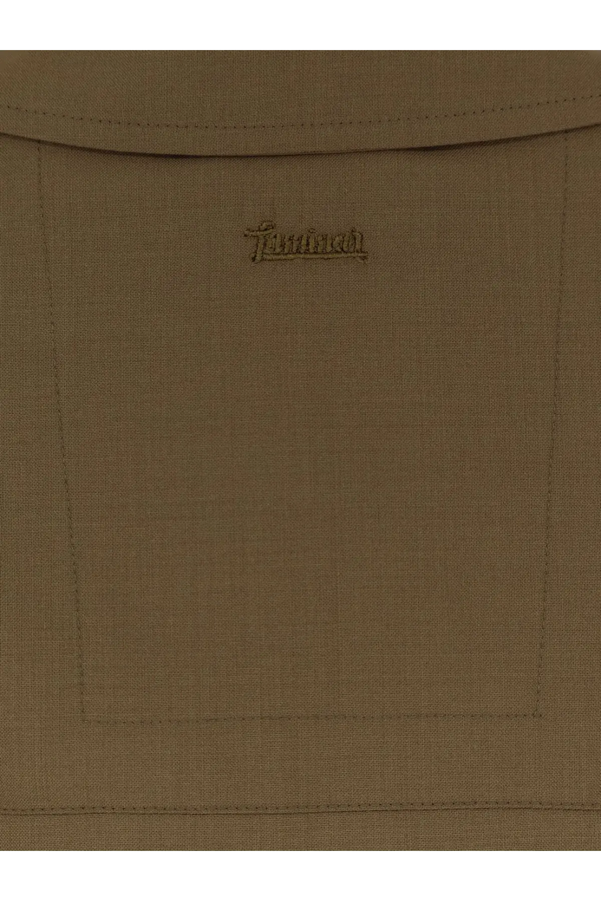 Tan linen backpack with subtle embroidered brand logo shown with laminar men’s wool blend shirt green