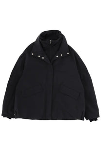 Laminar women’s black puffer jacket with high collar and silver-toned snap buttons for cold weather comfort