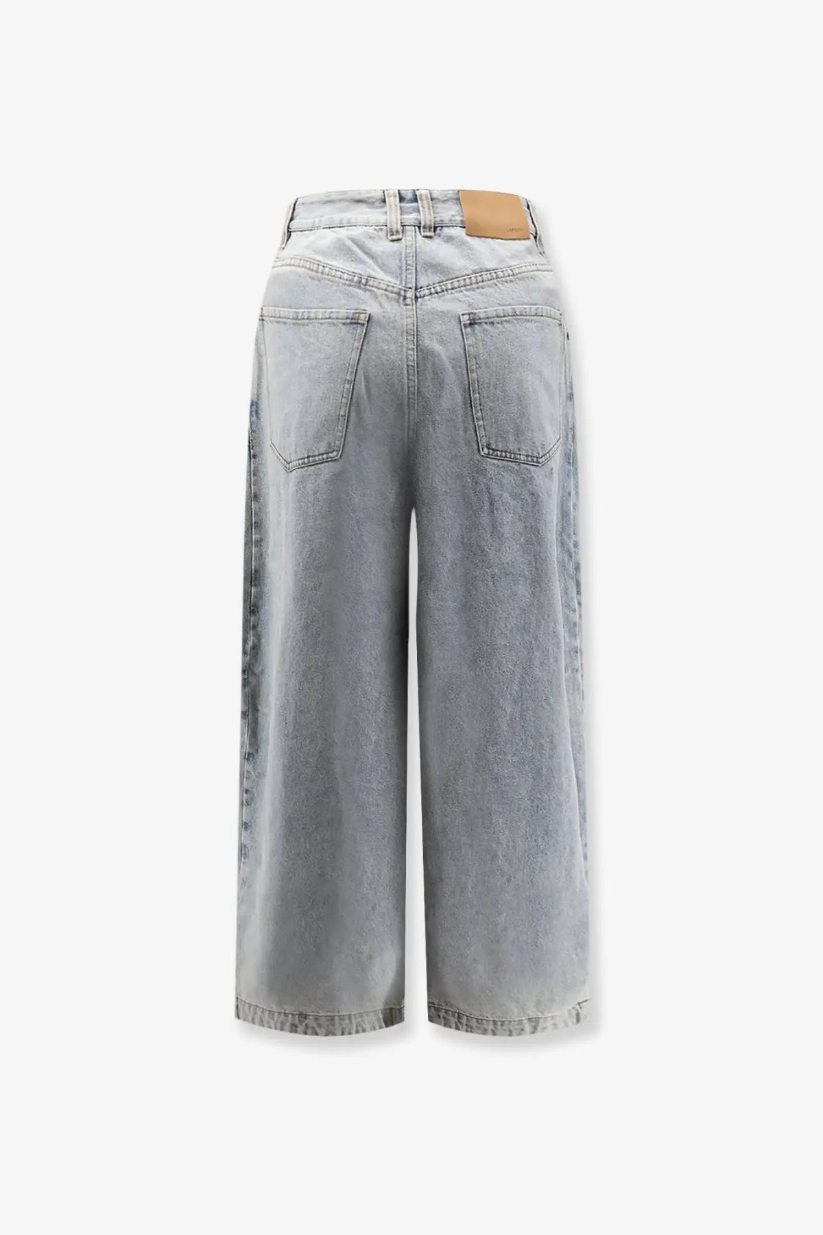 Back view of lamrons women’s balloon fit light-wash denim wide-leg jeans with classic pockets and tan leather patch