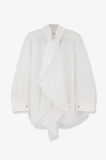 Lamrons women’s cotton shirt white with a flowing ruffled front and long sleeves in a classic blouse style