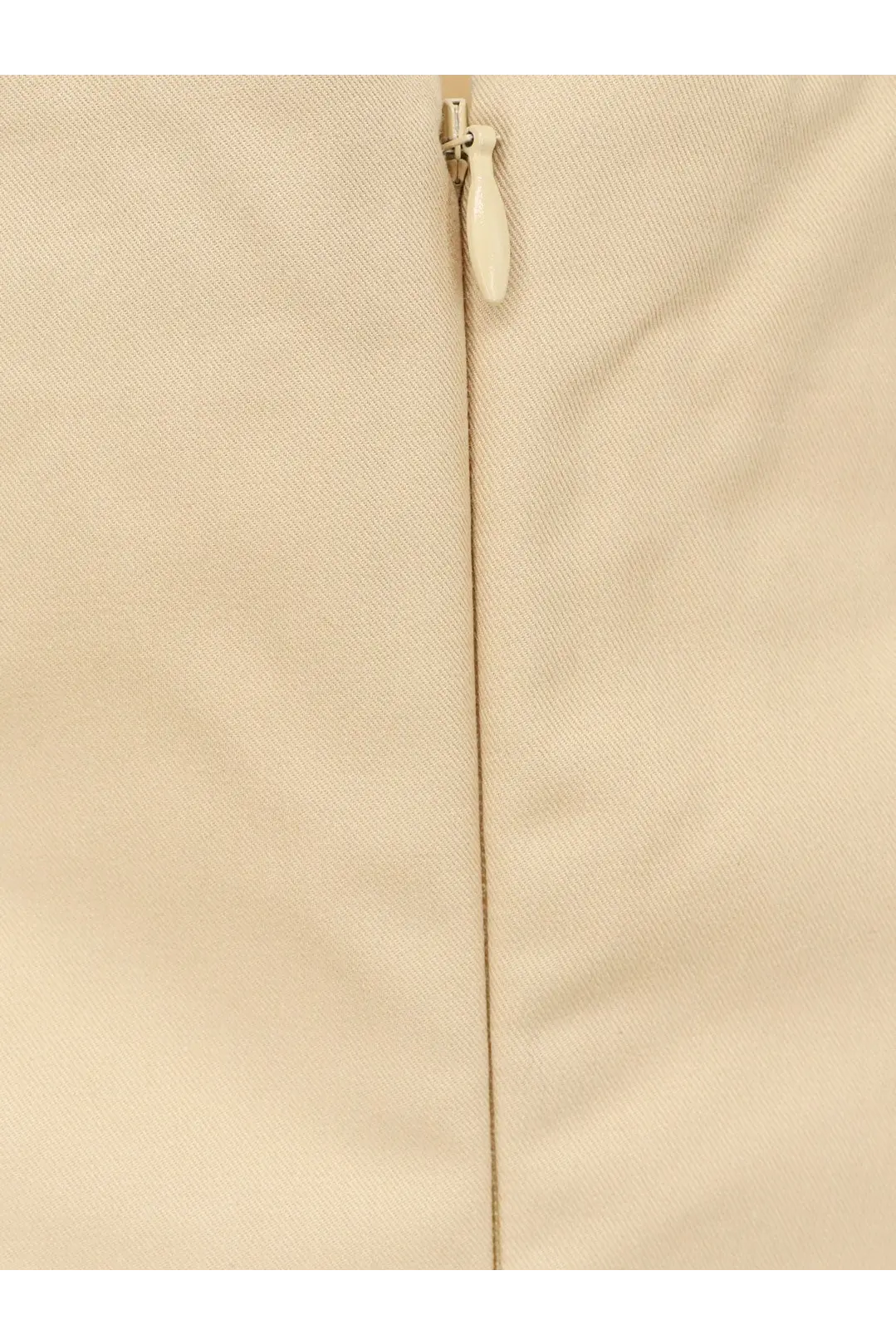 Cream-colored woven fabric with matching zipper pull on the back of lamrons women’s cotton and silk blend yellow top