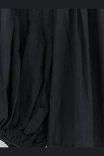 Black flowing fabric with soft folds and gathered hem of lamrons womens modal and silk blend dress grey back side
