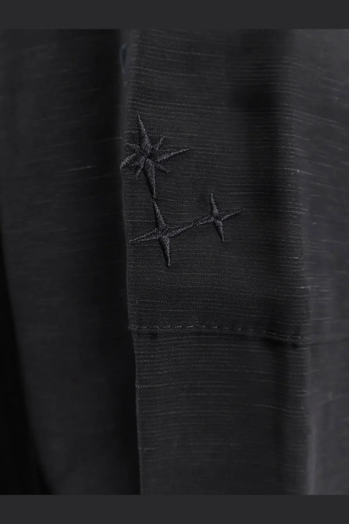 Laneus men’s viscose and linen black bermuda shorts with subtle horizontal texture and embroidered stars