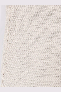 Cream-colored textured knitted fabric detail of laneus women’s white cotton dress