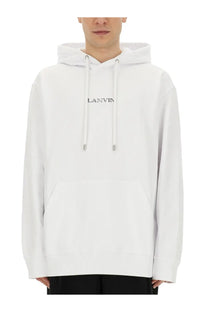 Lanvin men’s white hoodie with subtle black embroidery and silver toned drawstring tips in cotton fabric