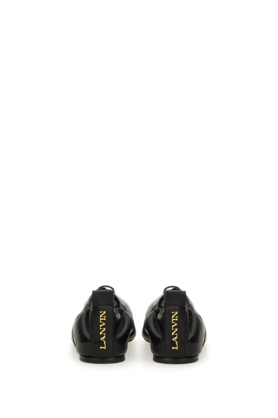 Black leather lanvin women’s lace up ballet flats with gold lettering on the heel showing the back side