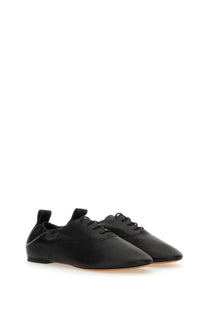 Lanvin women’s black leather lace-up flats with sleek minimalist design and subtle stitching details