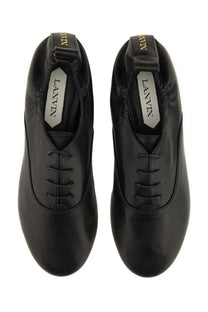 Lanvin women’s black leather lace-up slippers with a sleek minimalist design for stylish comfort
