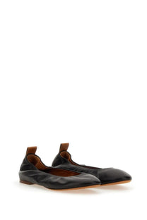 Lanvin women’s black leather ballerina flats with pointed toe and brown leather pull tabs on the back side