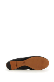Black leather flat shoe with tan rubber sole and lanvin brand name on the insole for women