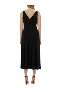 Black sleeveless midi dress by LANVIN with a deep v-back and flowing skirt, ideal for elegant occasions, shown from back side
