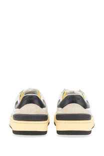 Beige and black lanvin women’s suede and nappa leather sneakers with yellow heel tab accents shown from the back side