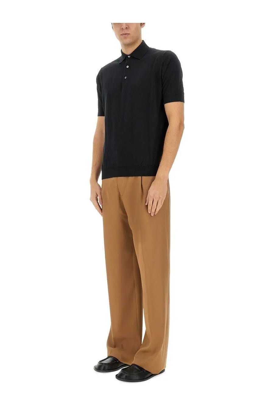 Black short-sleeved polo shirt with classic collar and button placket paired with beige lardini men’s wool pants
