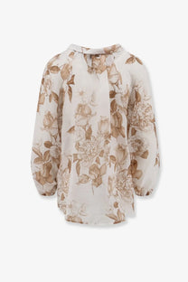 A delicate ivory Lavi women’s Afrodite ramié blouse with flowing long sleeves and an elegant brown floral pattern
