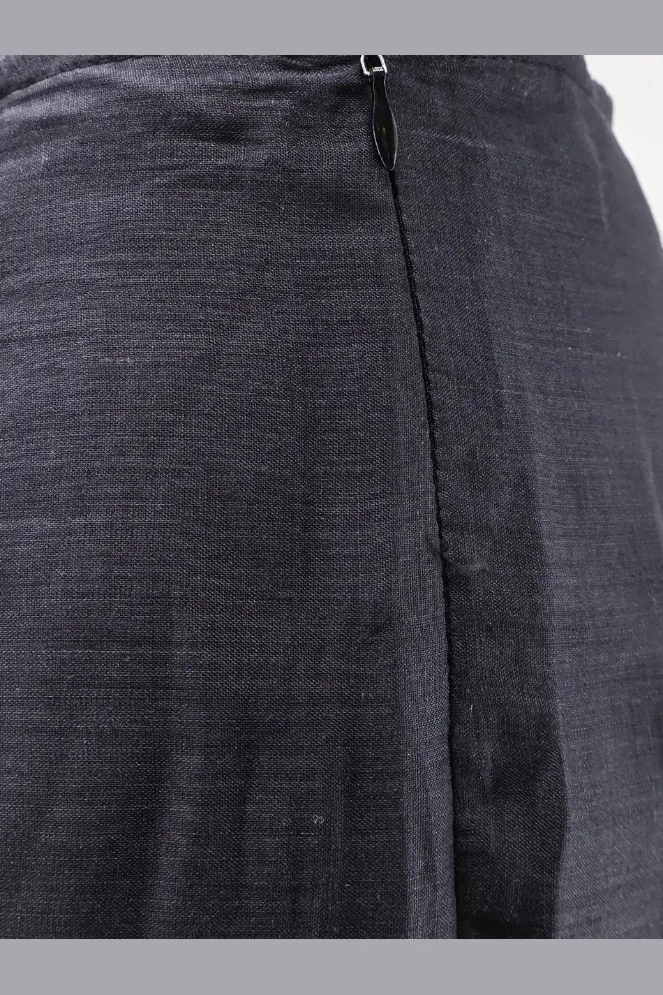 Dark gray linen skirt with black center zipper shown from back in product titled lavi women’s frangipane ramié trousers beige