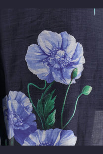 Dark blue linen Lavi women’s frangipane ramie trousers with light purple poppy print and green stems and buds