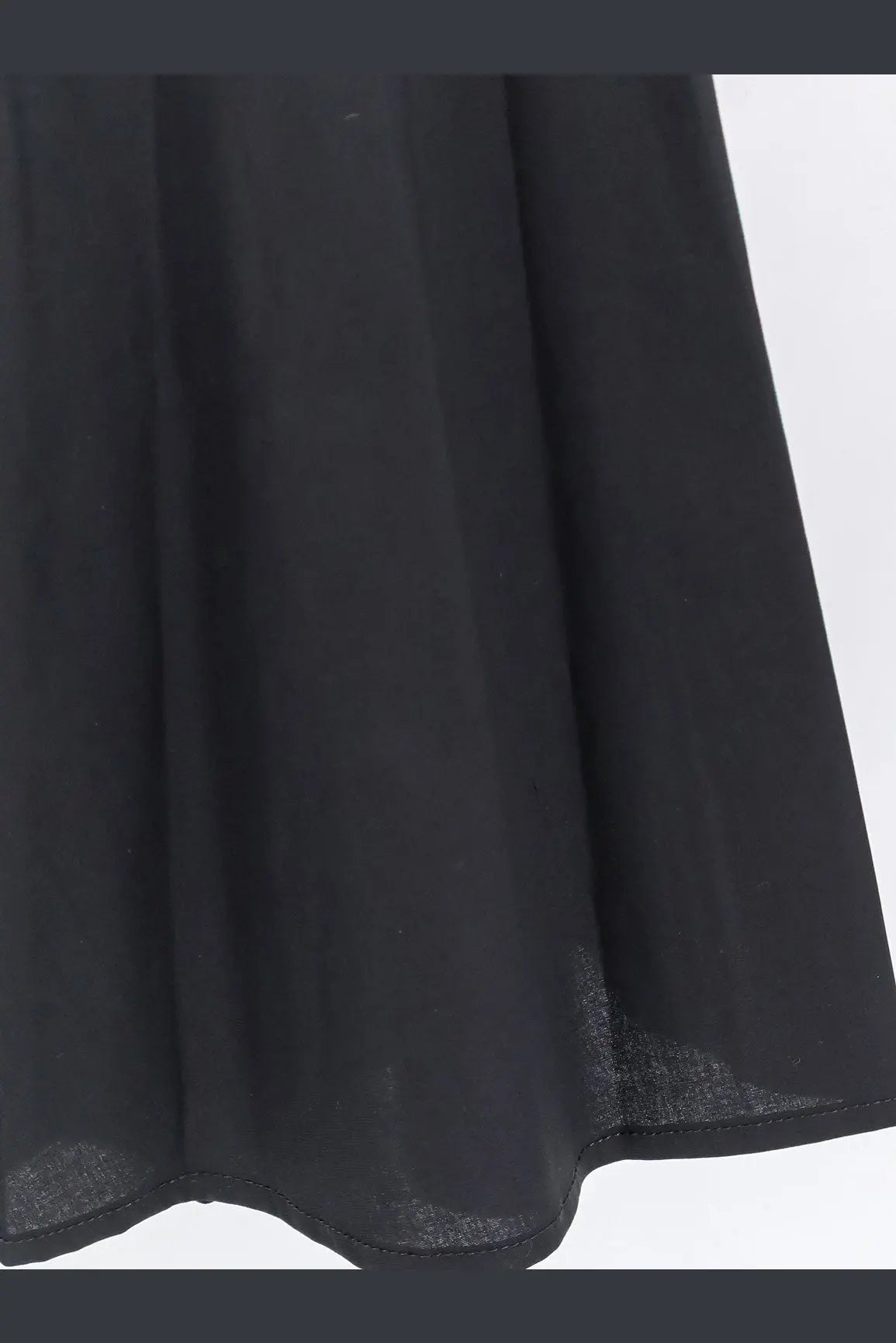 Black sheer fabric skirt with flowing pleated design from lavi women’s mambo cotton dress black collection