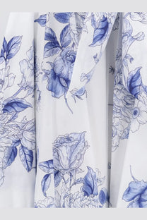 White fabric with a delicate blue floral pattern featuring roses and leaves for lavi womens mambo cotton dress blue