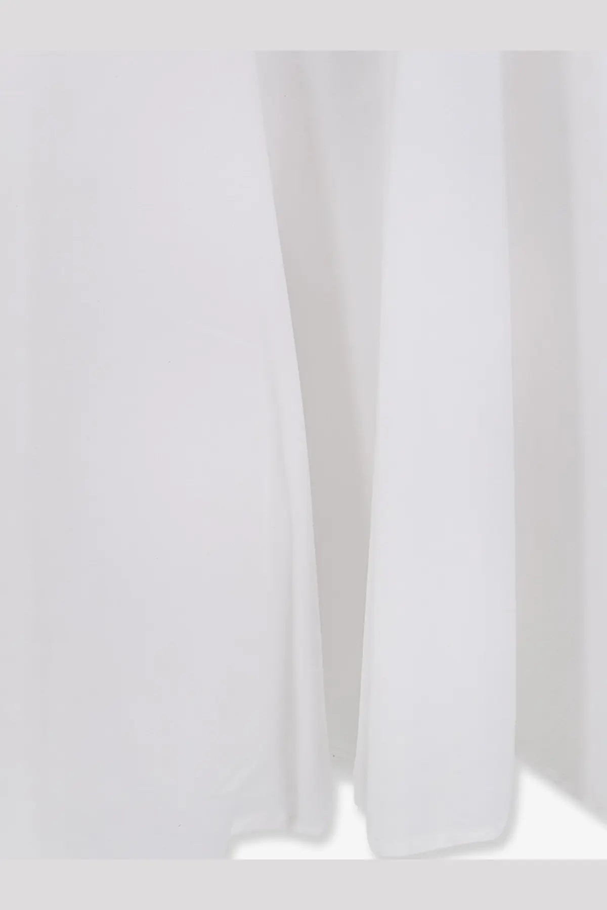 Lavi women’s mambo cotton dress white with flowing white fabric featuring soft folds and smooth texture