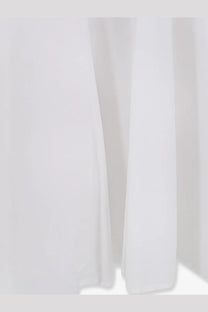 Lavi women’s mambo cotton dress white with flowing white fabric featuring soft folds and smooth texture