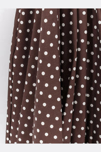 Brown cotton polka dot skirt with white circular patterns from lavi women’s mambo dress collection