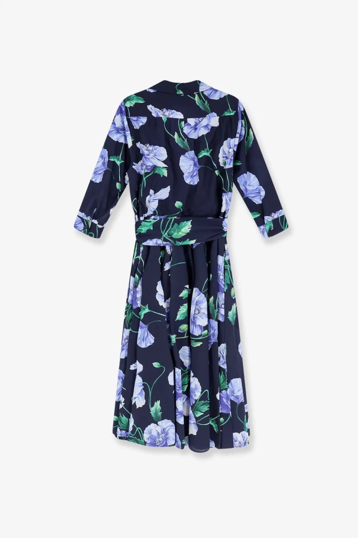 A navy blue cotton wrap dress with a vibrant purple floral pattern and green leaves cinched at the waist by Lavi Women