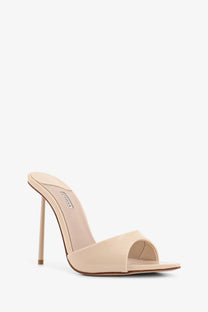 Beige patent leather slip-on sandal with slender high heel and minimalist design from le silla women’s bella collection