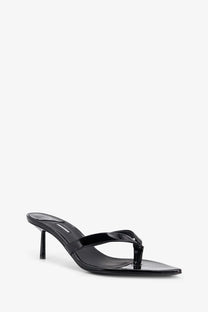 Le Silla women’s Gisele black patent leather thong sandal with a slender heel shown from the back side