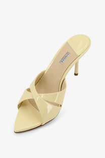 Le Silla women’s shirley cream patent leather mule sandal with slender heel and crisscross strap design