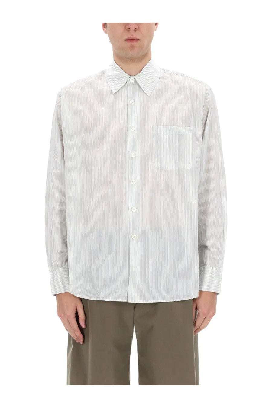 Our legacy men’s above shirt white is a crisp white button-down shirt with subtle vertical pinstripes and a classic collar