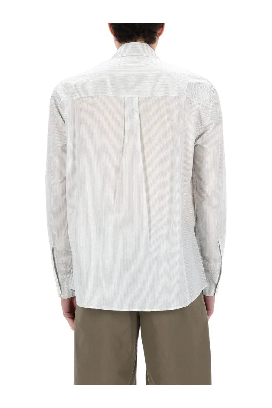 Our Legacy men’s above shirt white is a crisp white button-down with subtle vertical pinstripes and a tailored fit