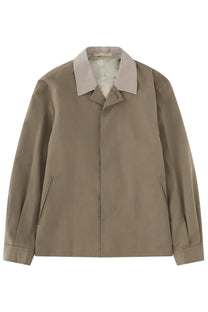 Our Legacy men’s beige trench coat with light gray collar and subtle vertical stitching details