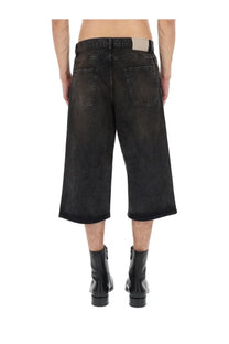 Our Legacy men’s green capri cut shorts made of black faded distressed denim with a straight-leg cut