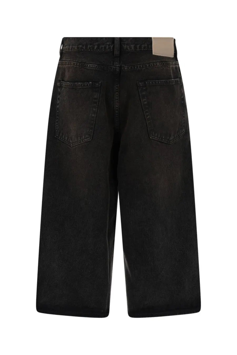Black denim Our Legacy men’s capri cut shorts with a faded distressed finish and classic back pockets shown from the back