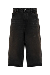 Our Legacy men’s green distressed denim shorts with high waist and wide legs in a capri cut style