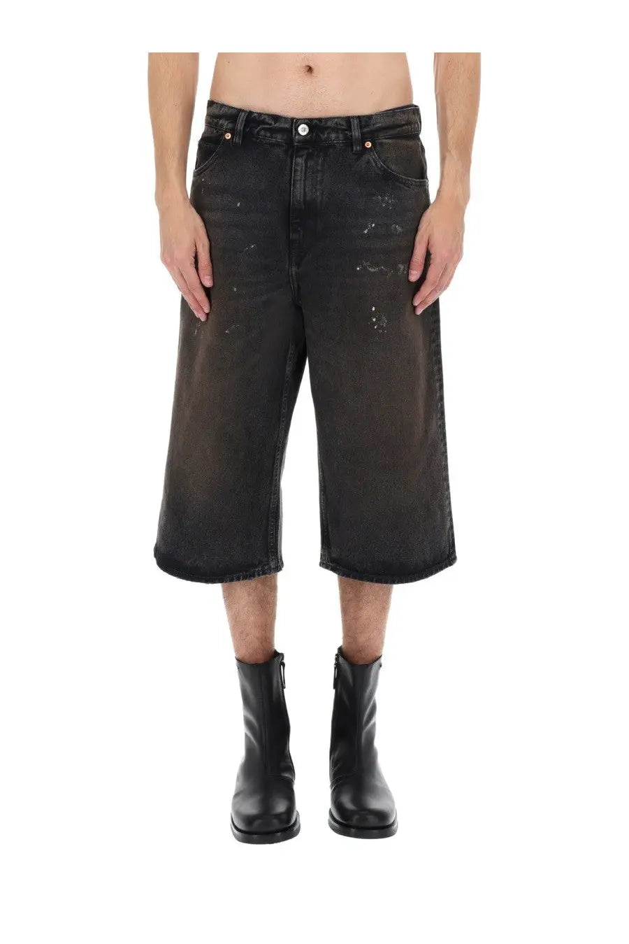 Our legacy men’s green capri cut shorts made of faded black distressed denim with a wide-leg design