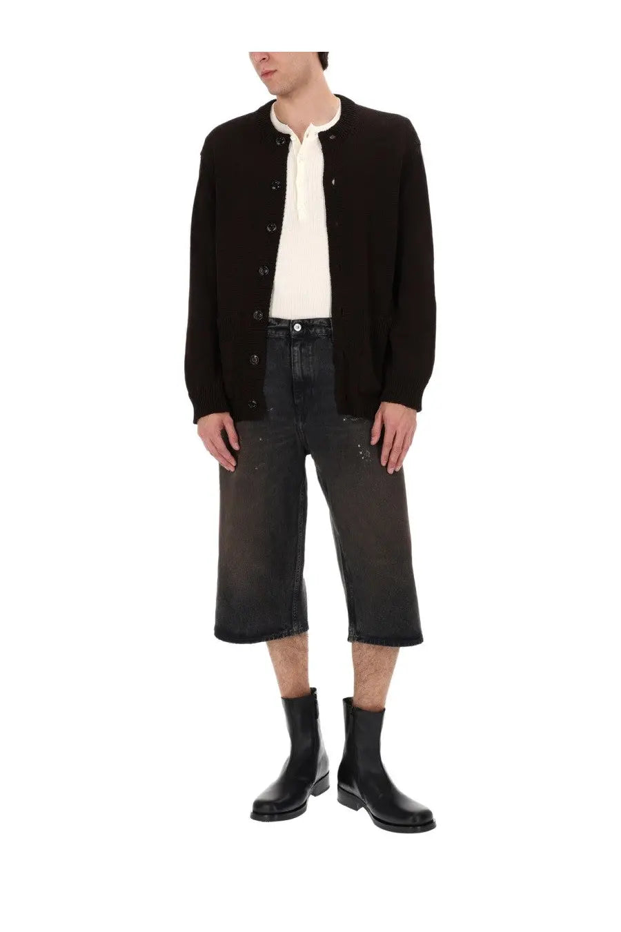 Black knitted cardigan with button closure and ribbed cuffs paired with Our Legacy men’s green Capri cut shorts