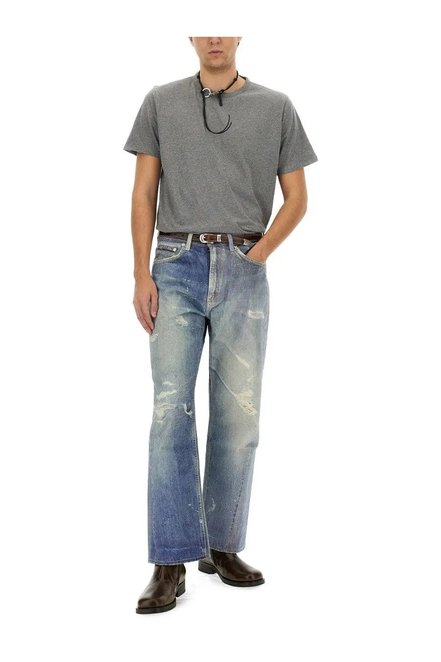 Distressed blue denim flare jeans paired with our legacy men’s grey cotton shirt front view